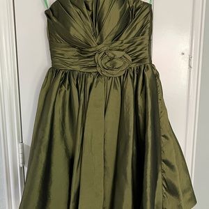Shiny green with a flower rose on the front of the dress and a corset tie back